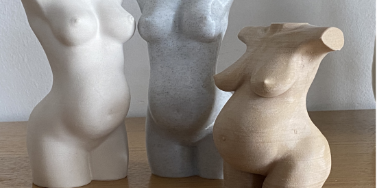 3 pregnant women sculptures